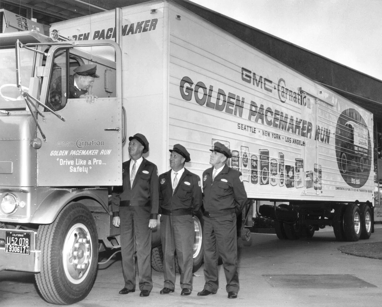 Transcontinental carnation run photo of semi and workers